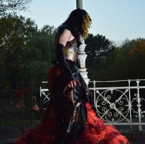 model showing a once in a lifetime by se'tyo dress in fire colors