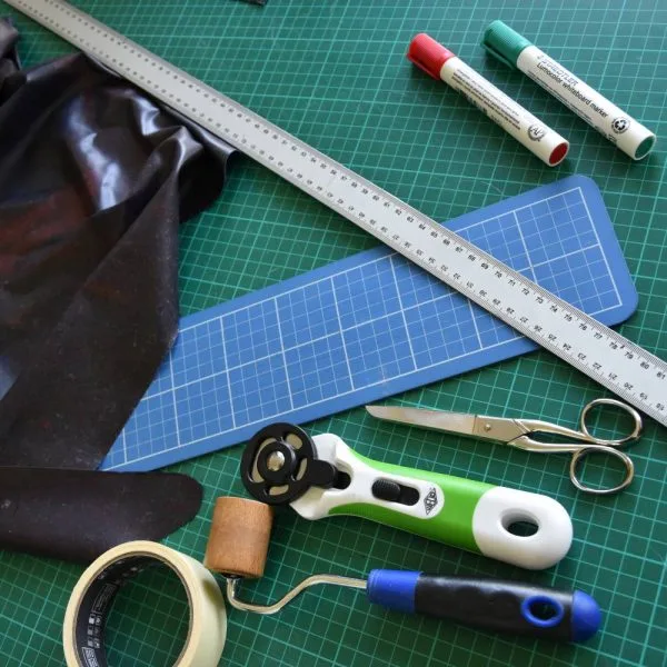 different tools for latex creation on a cutting mat