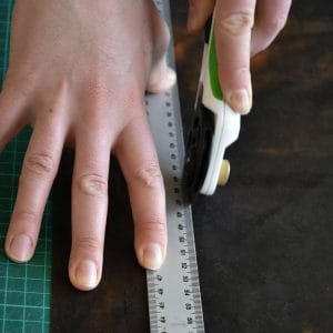 cutting a latex sheet with a roller blade