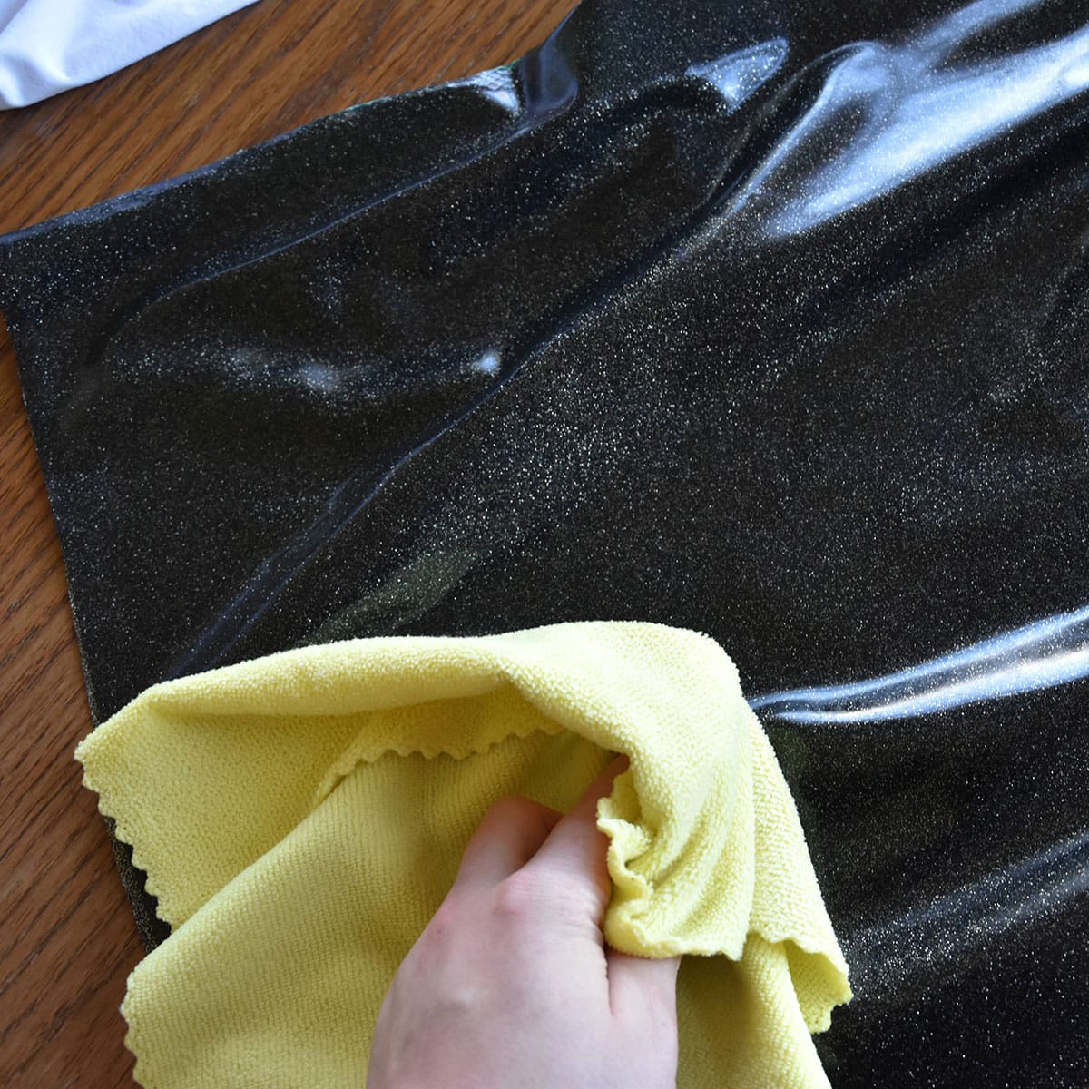 oiling a latex item with a microfiber cloth