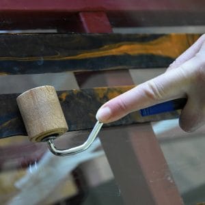 pressing items together using a wooden roller
