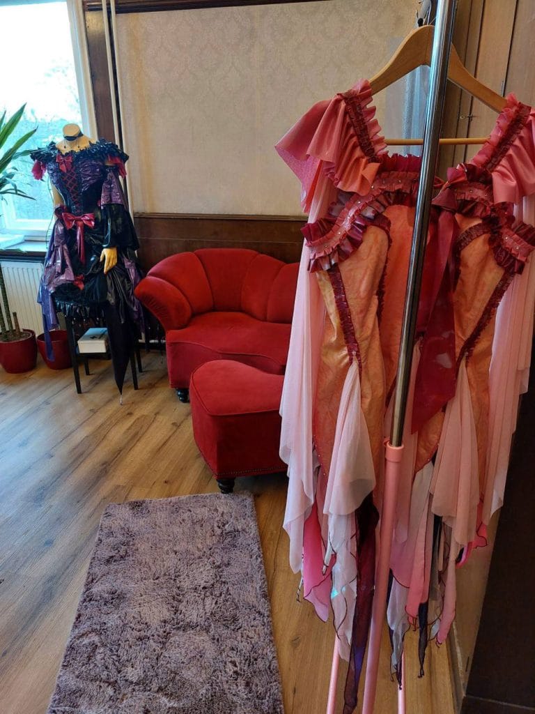 showroom in our atelier with a pink dress on a rack