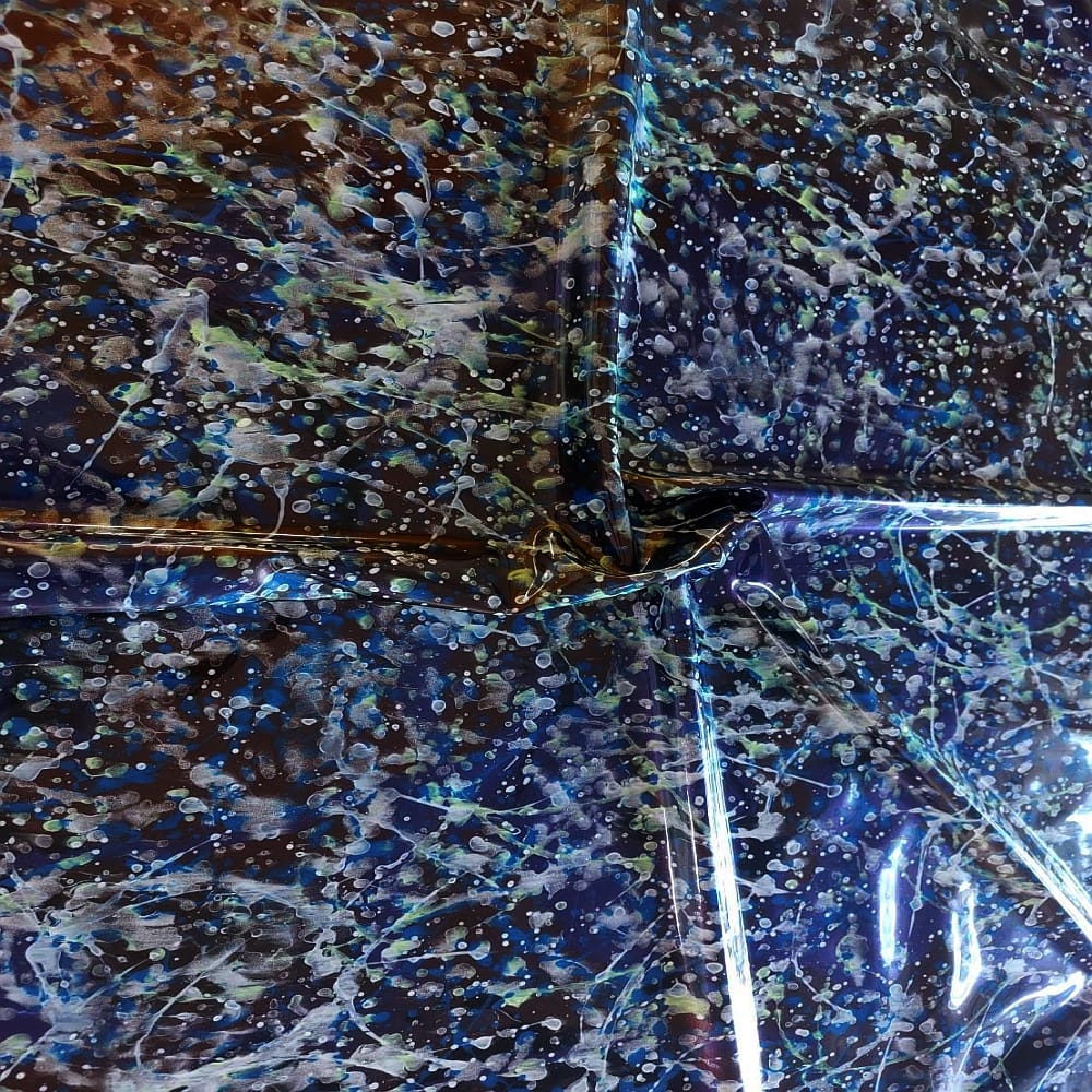 multi colored latex sheet with white, green and blue splatters