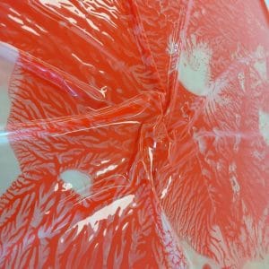 coral patterned latex sheet in red
