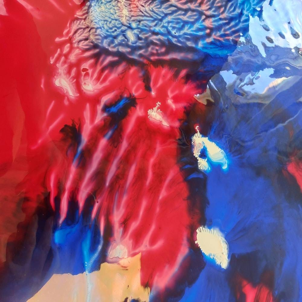 coral patterned latex sheet in blue and red