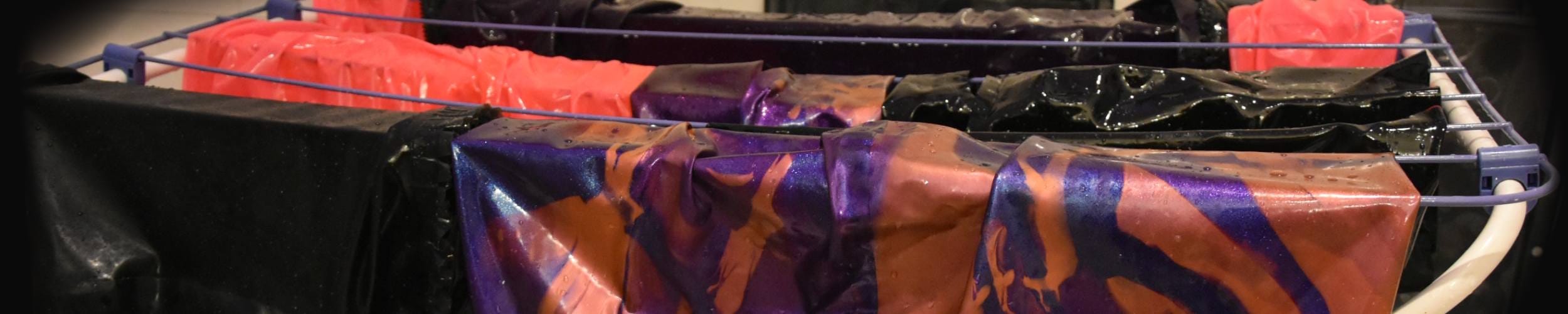 latex items being hanged for drying after washing