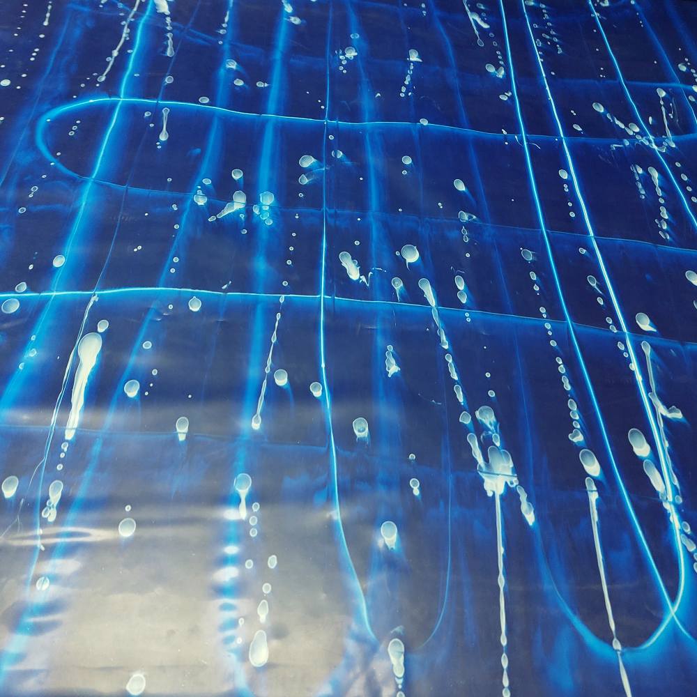 blue latex sheet with organic water patterns