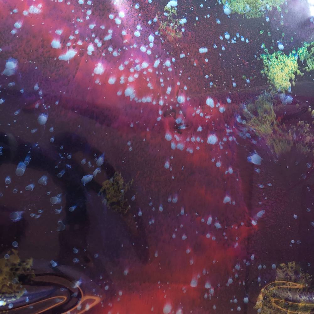 latex sheet with a dark colorful galaxy pattern