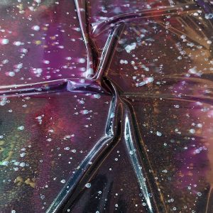 latex sheet with a dark colorful galaxy pattern