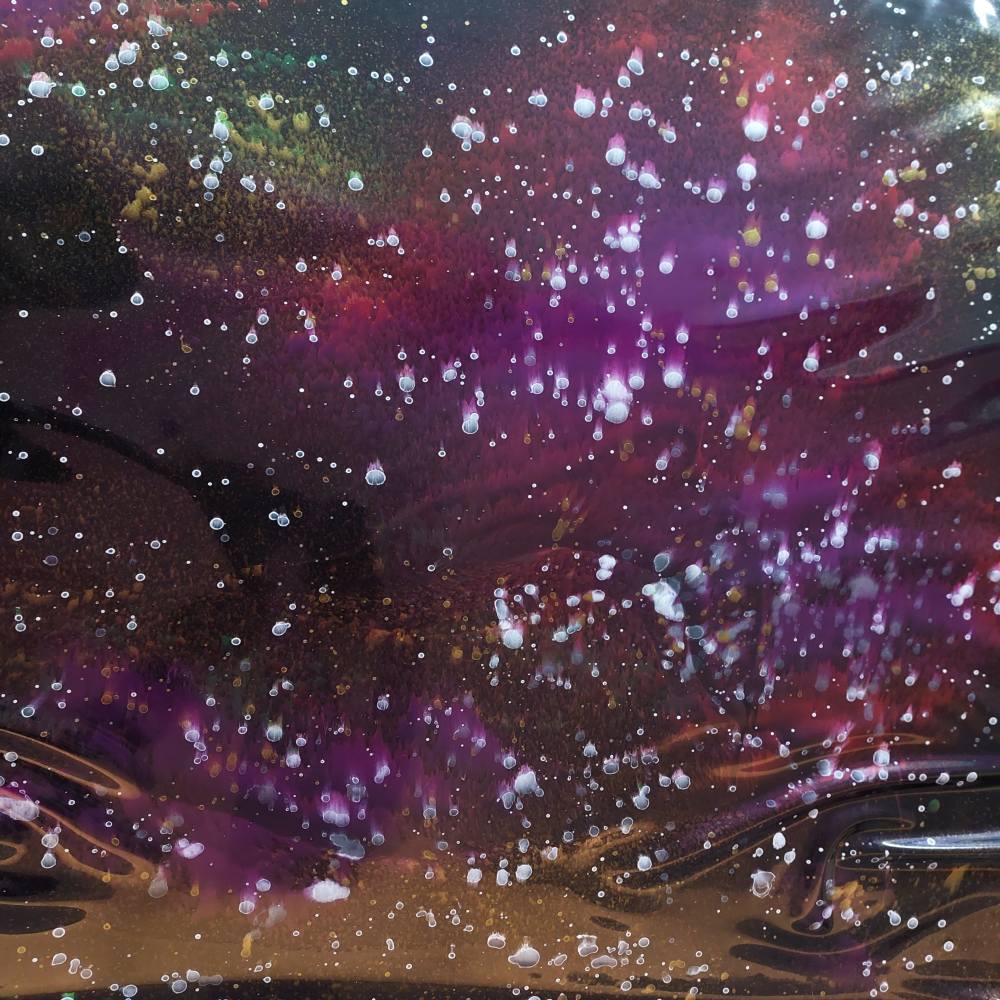 latex sheet with a dark colorful galaxy pattern