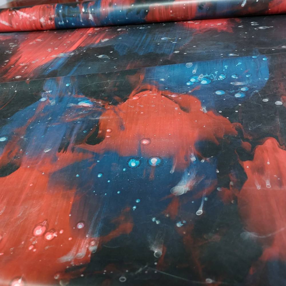 blue and red latex sheet in galaxy pattern
