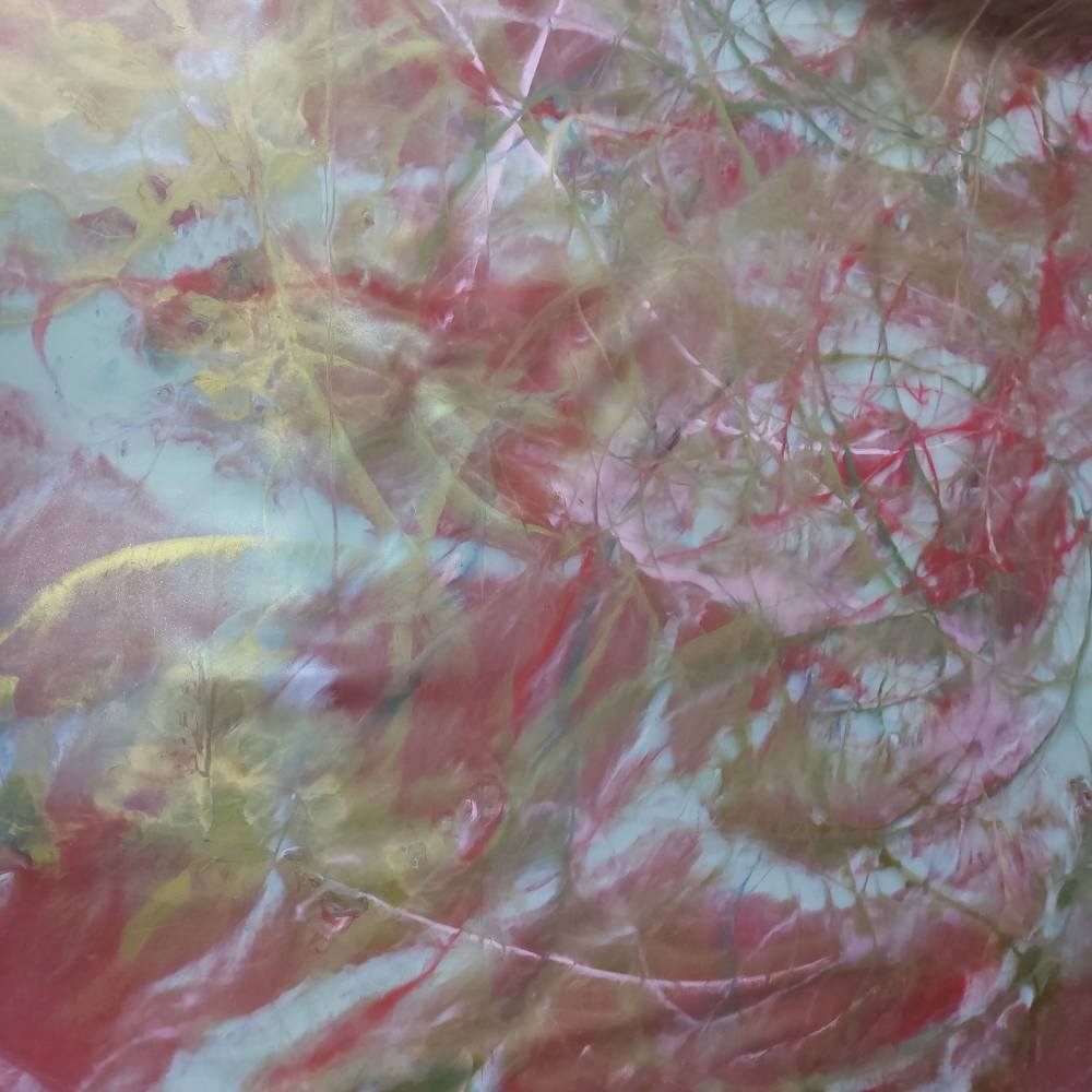 pink and golden latex sheet in a marbled pattern