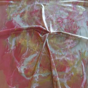 pink and golden latex sheet in a marbled pattern