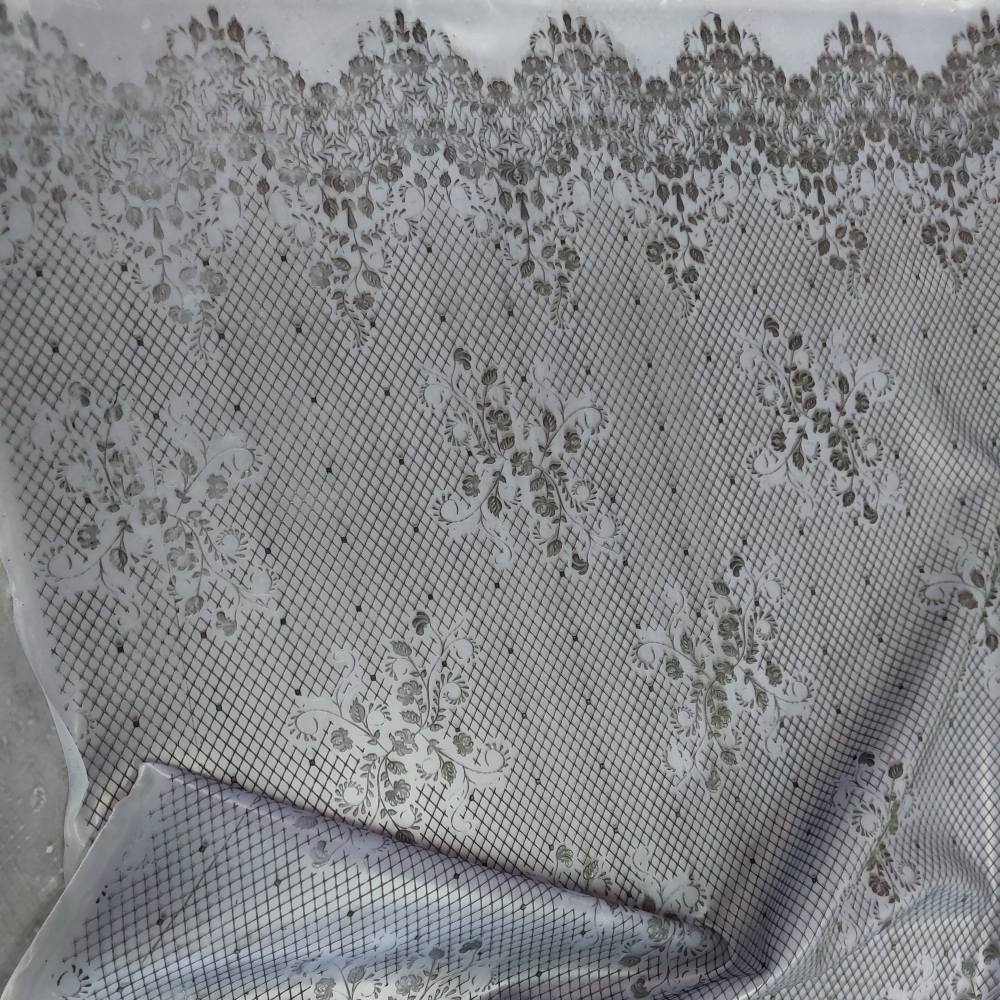 black lace pattern on a crystal clear latex sheet