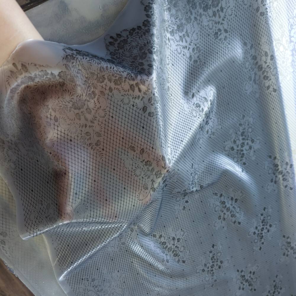 black lace pattern on a crystal clear latex sheet