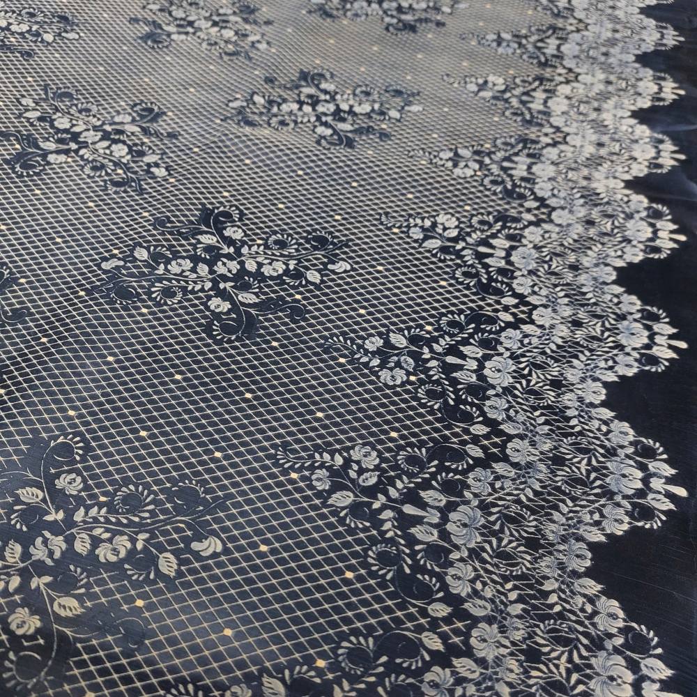 black latex sheet with neon orange lace pattern