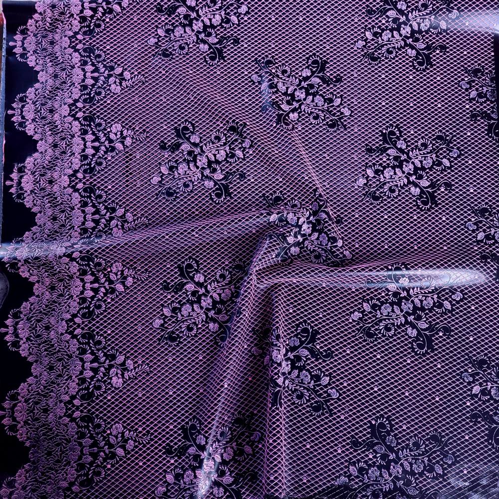 pink lace pattern on a dark latex sheet