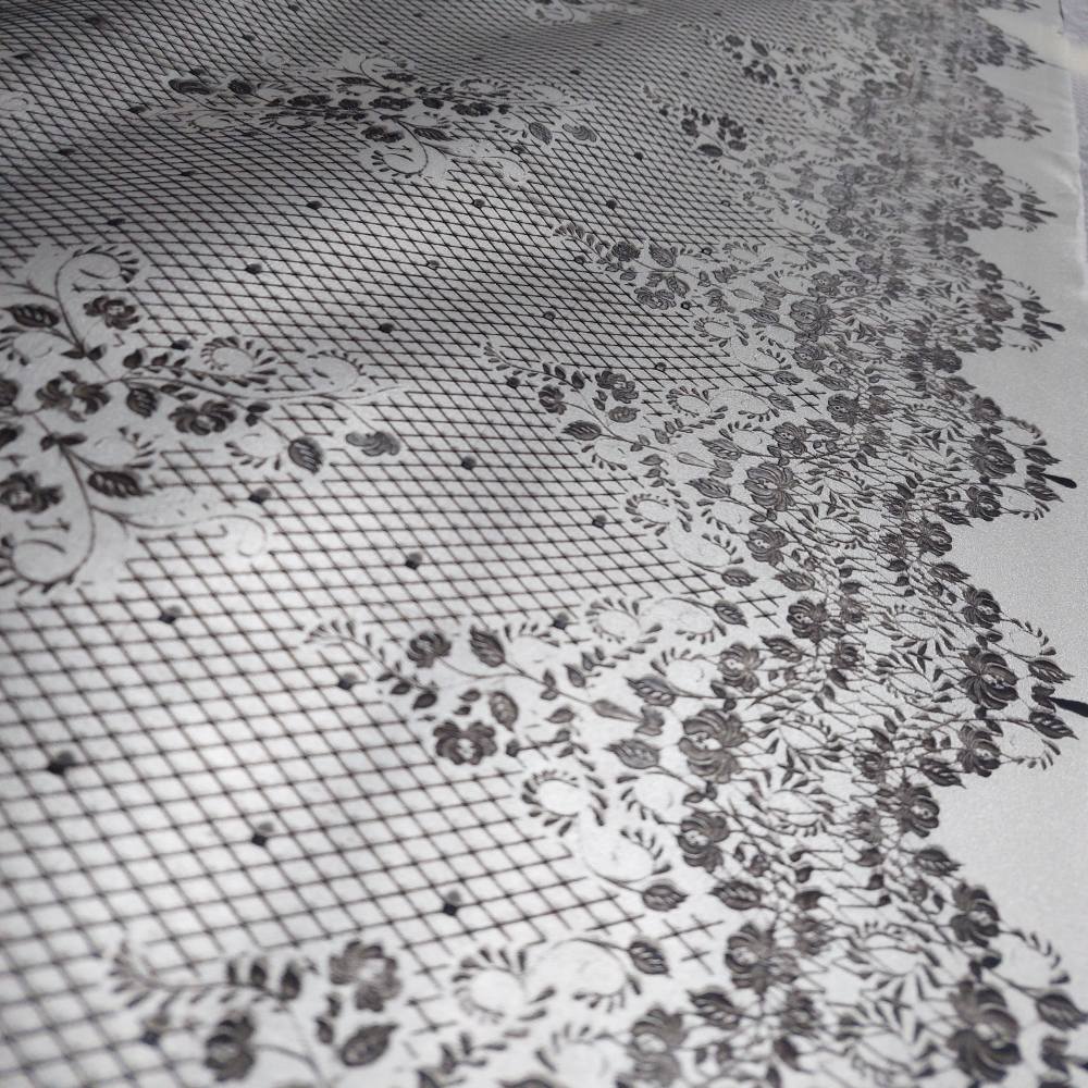 silver latex sheet with a black lace pattern
