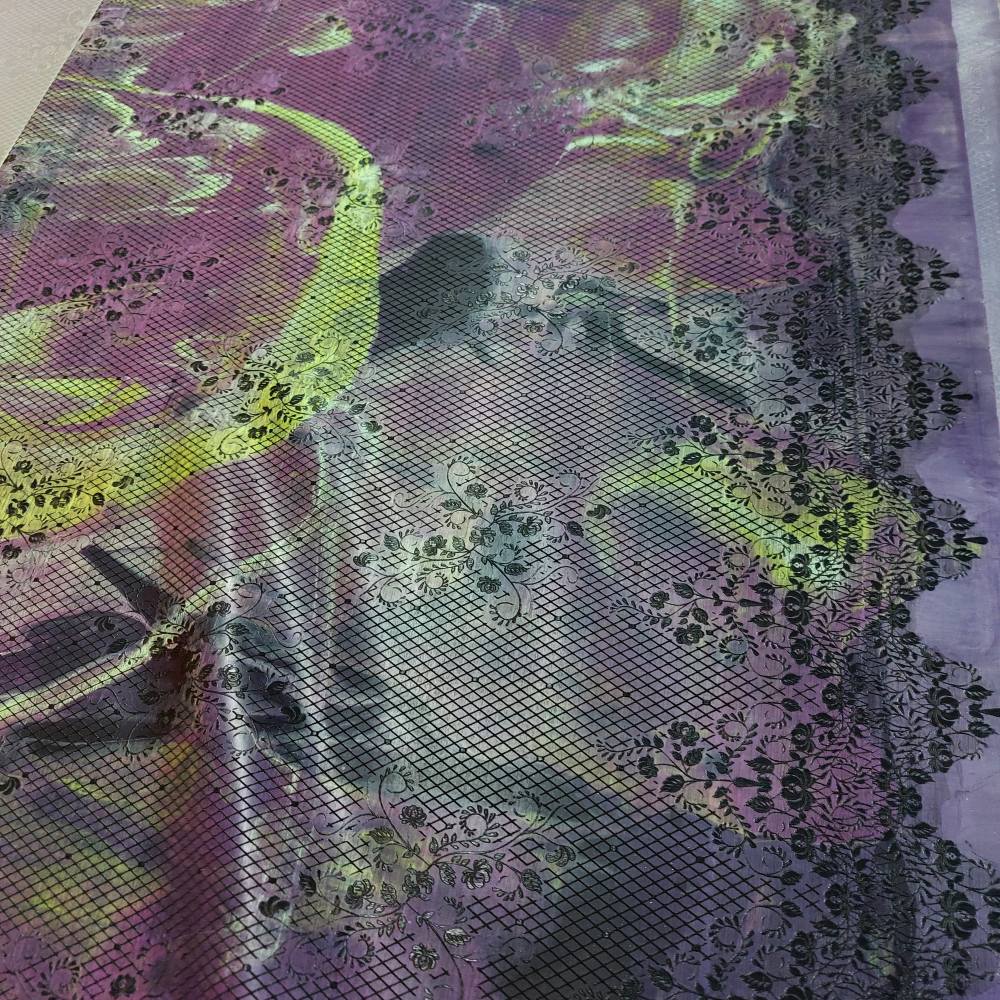 marbled latex sheet with a black lace pattern