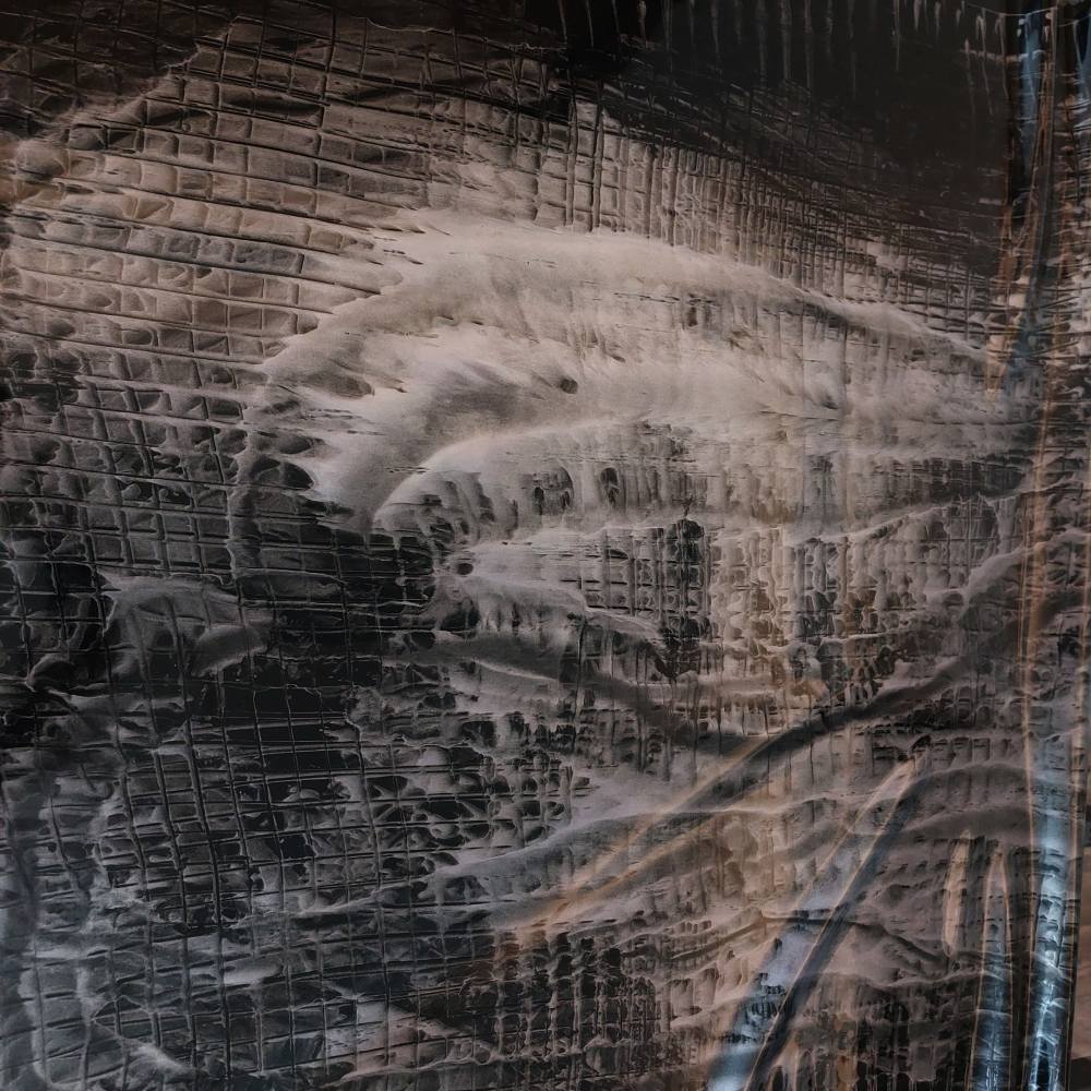 black latex sheet with a silver tweed pattern